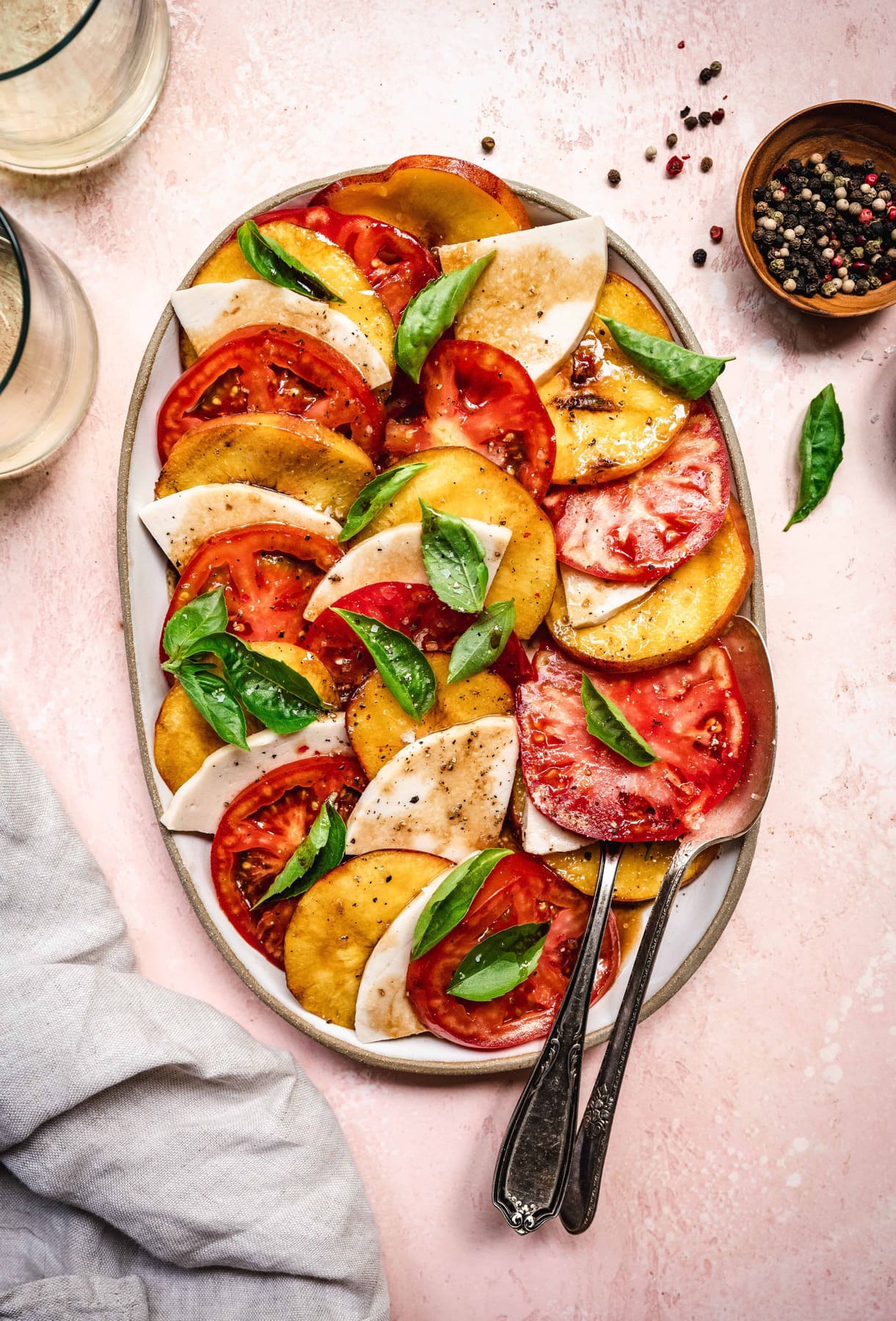 overhead of vegan grilled peach caprese salad with balsamic dressing