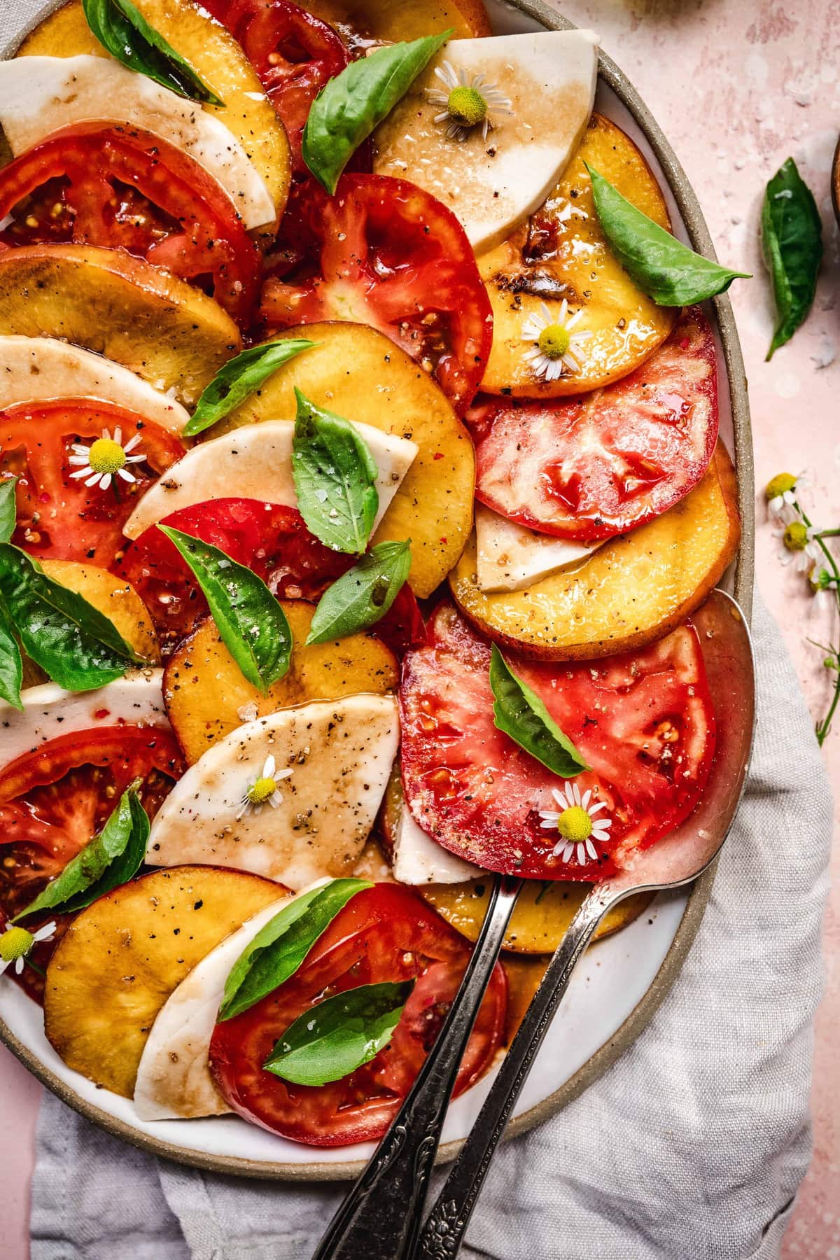 overhead of grilled peach caprese with dairy-free mozarella and balsamic dressing