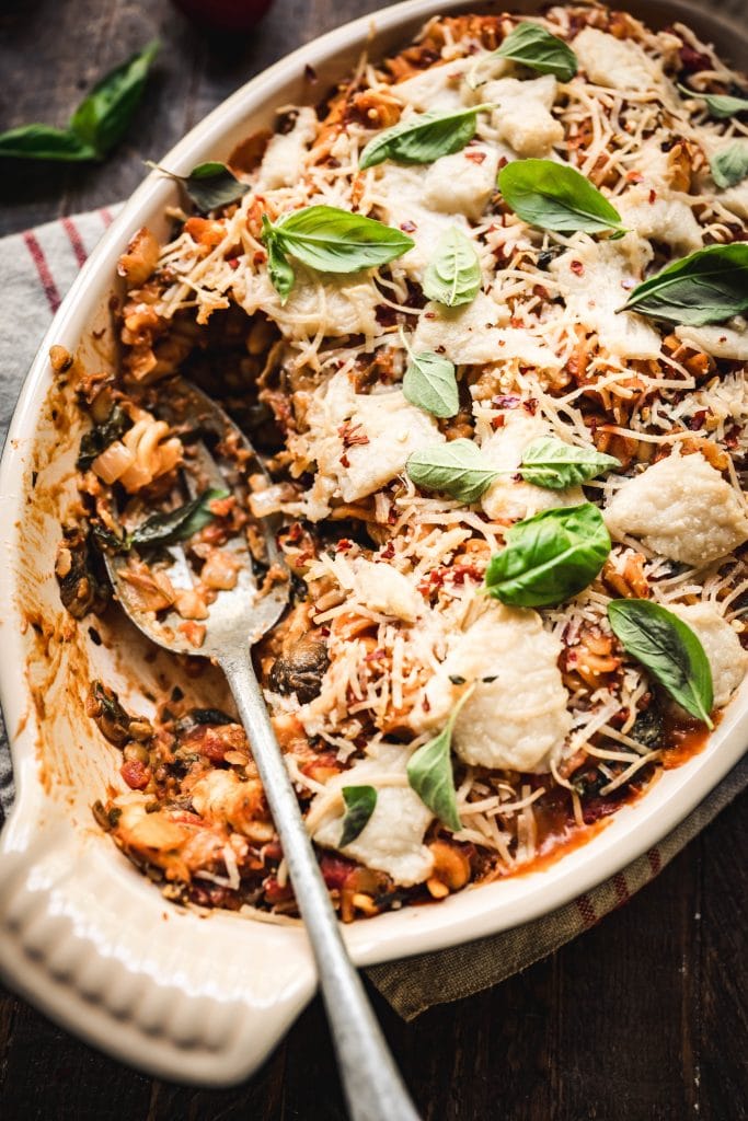 Close up view of serving gluten free pasta bake with vegan cheese