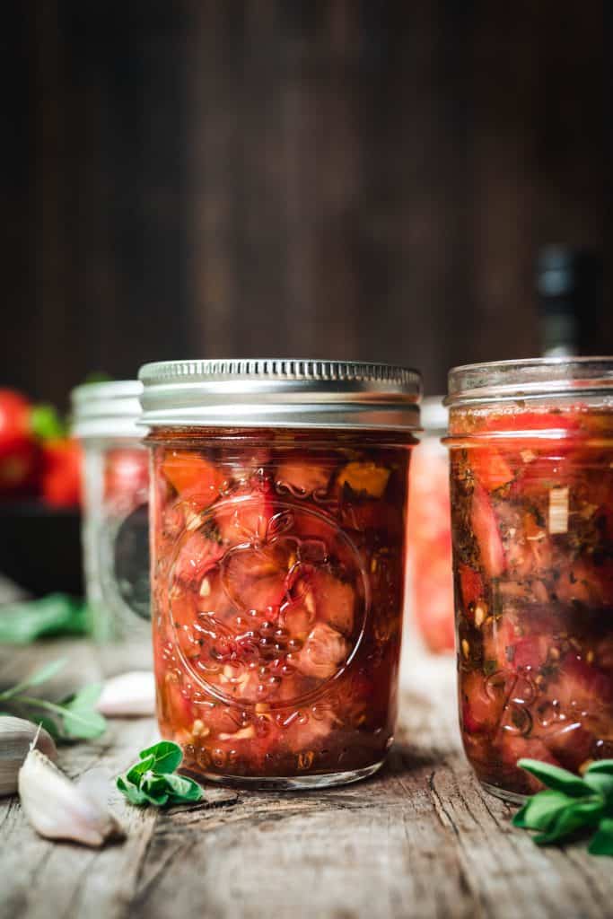 side view of tomato bruschetta in a jar