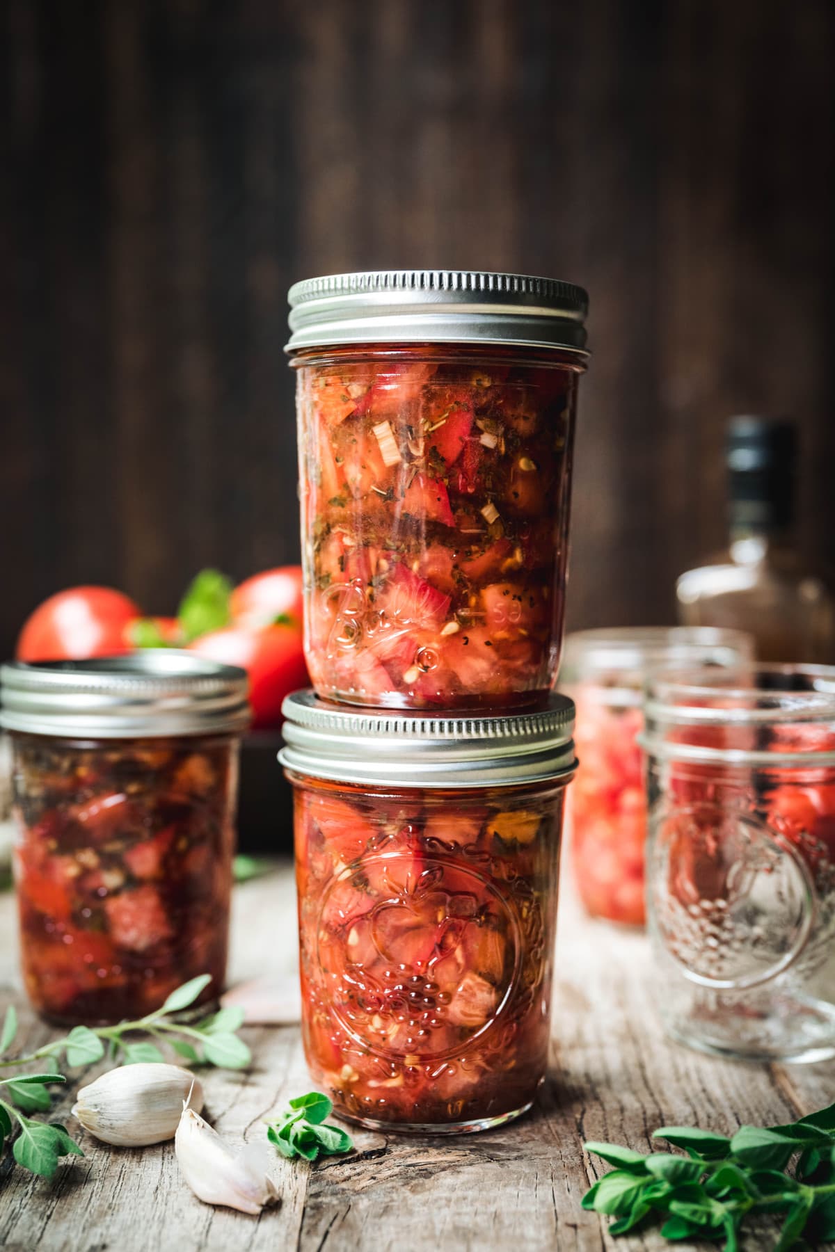 side view of tomato bruschetta in a jar