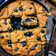 Overhead of gluten free blueberry cornbread in a skillet.