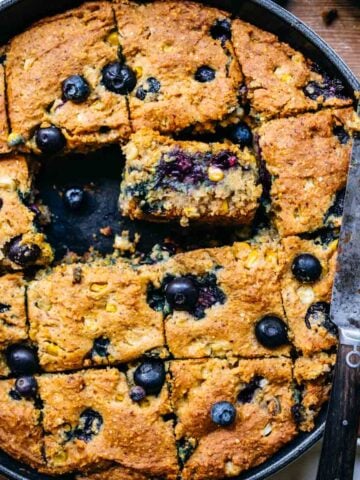 Overhead of gluten free blueberry cornbread in a skillet.