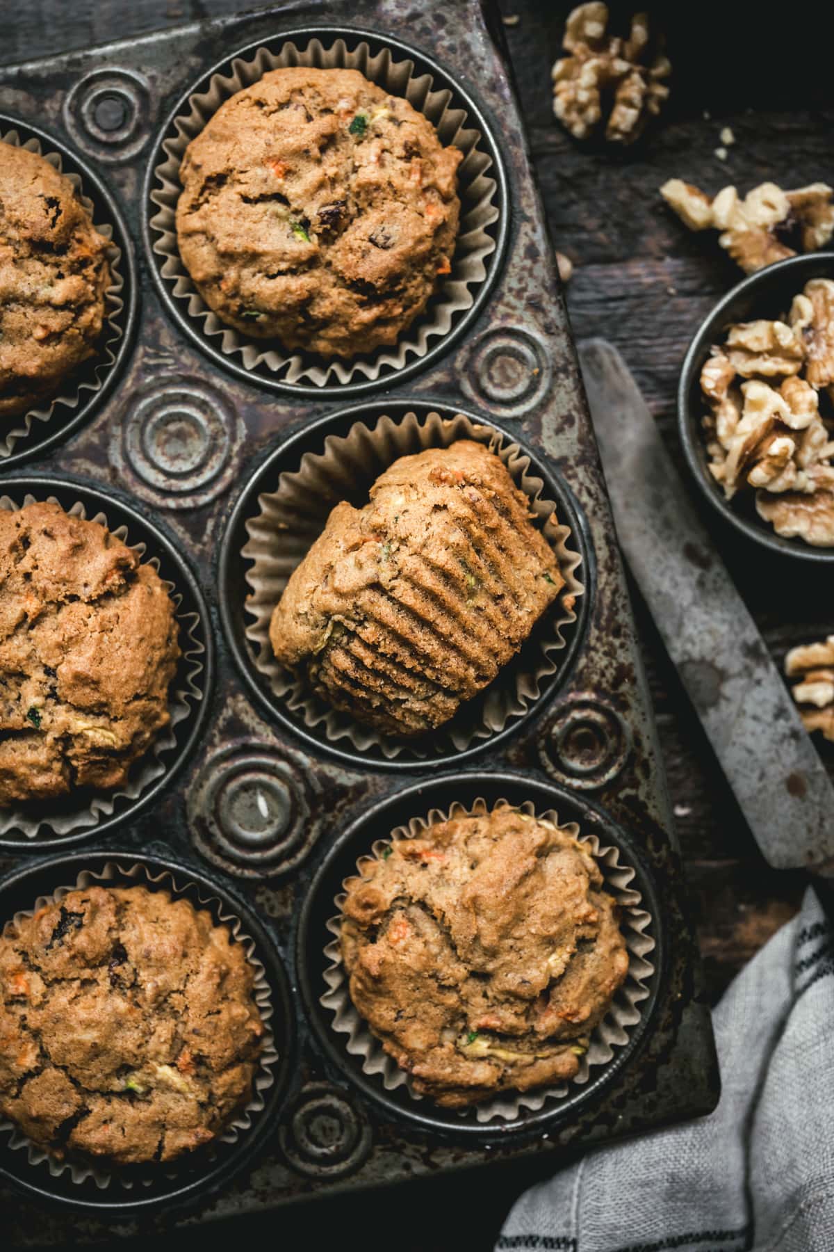 overhead of cooked vegan zucchini muffins in a muffin tin