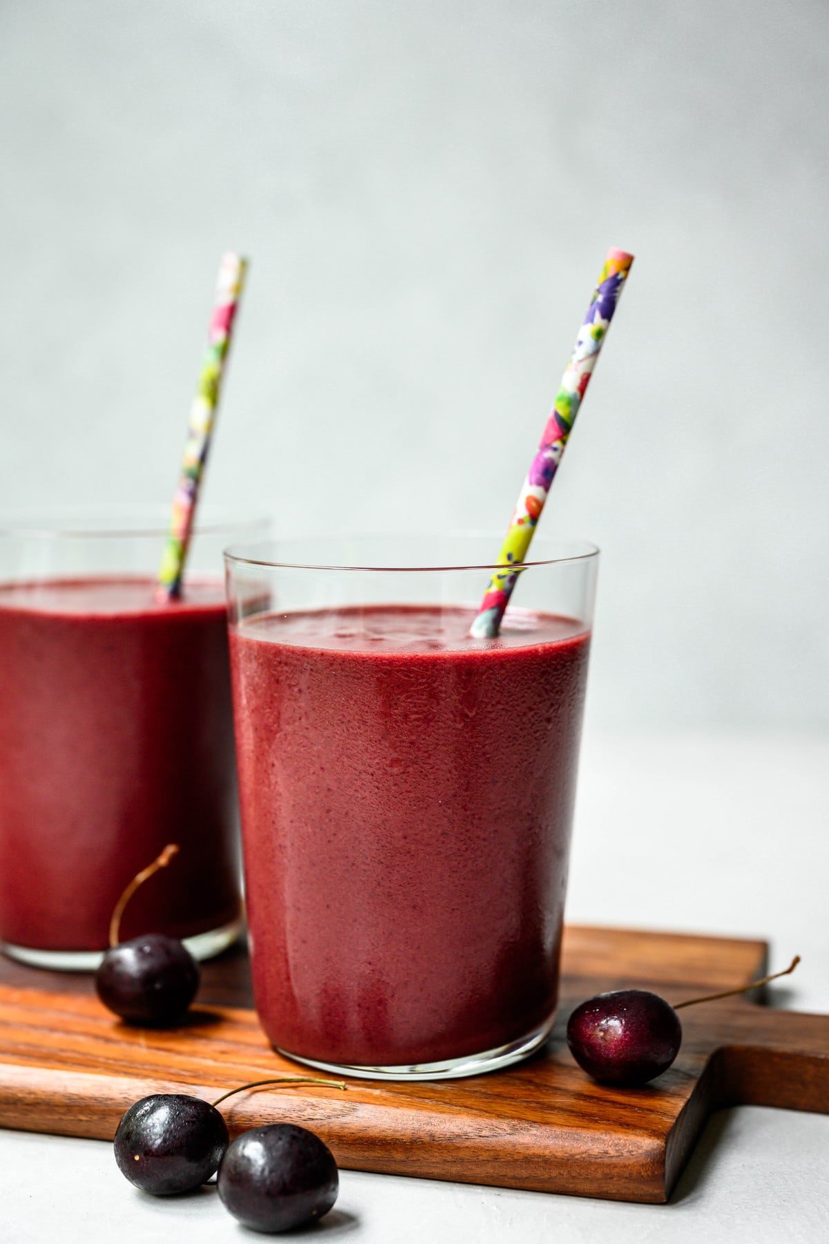 side view of two glasses of tart cherry dark chocolate recovery smoothie