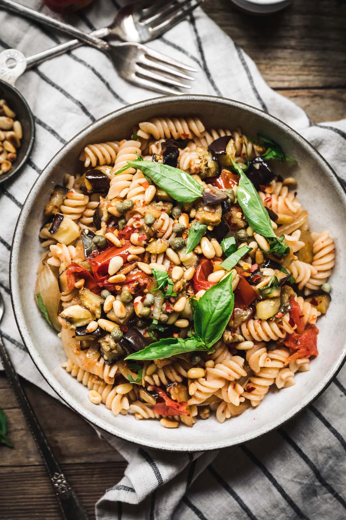 overhead of roasted eggplant tomato pasta in a bowl