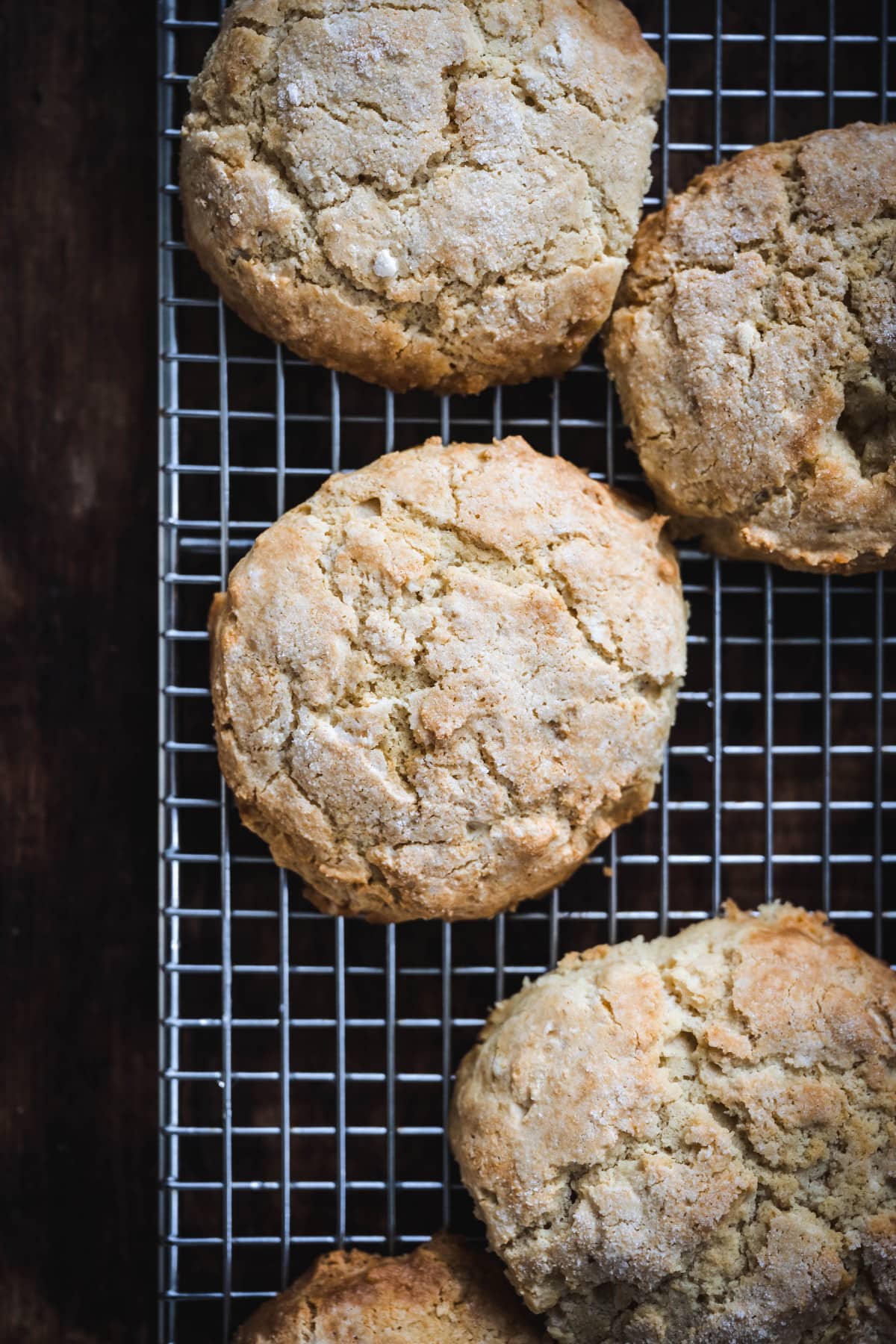 overhead of freshly baked vegan shortcake biscuits on a wire baking rack