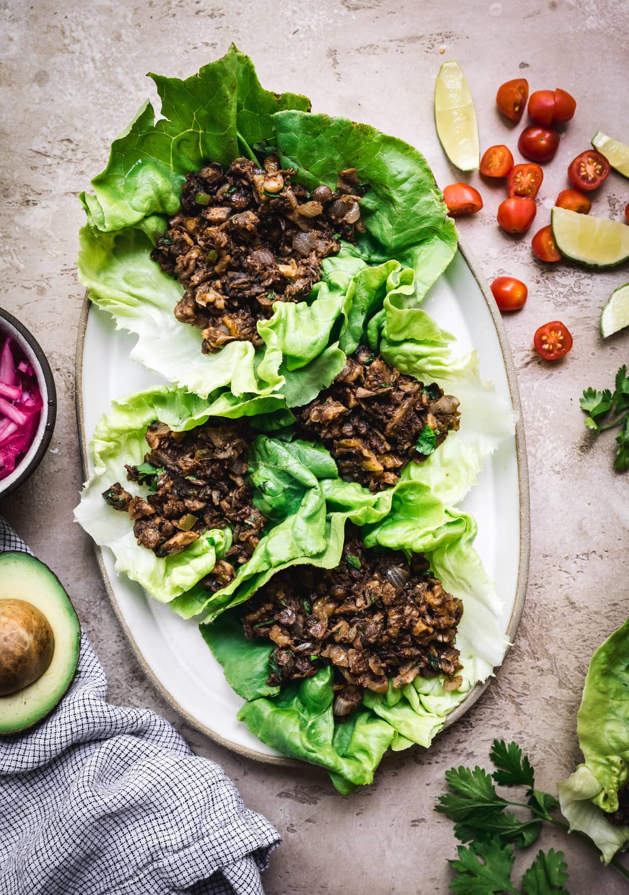 overhead of lettuce leaves filled with vegan taco filling