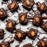 overhead of several vegan almond joy bars on a white background