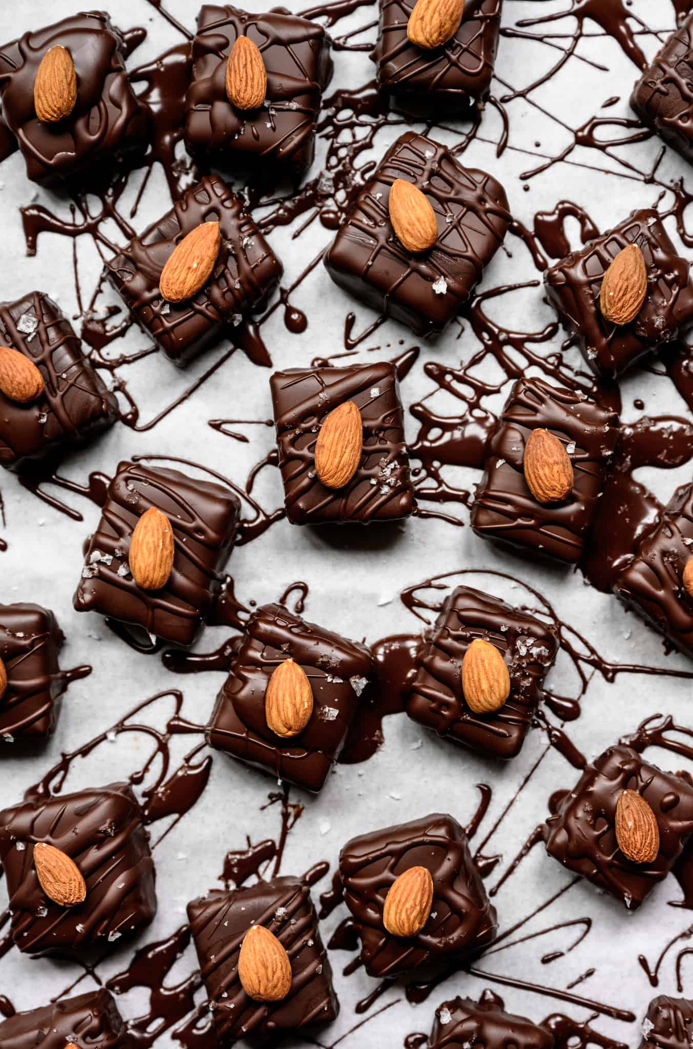 overhead of several vegan almond joy bars on a white background