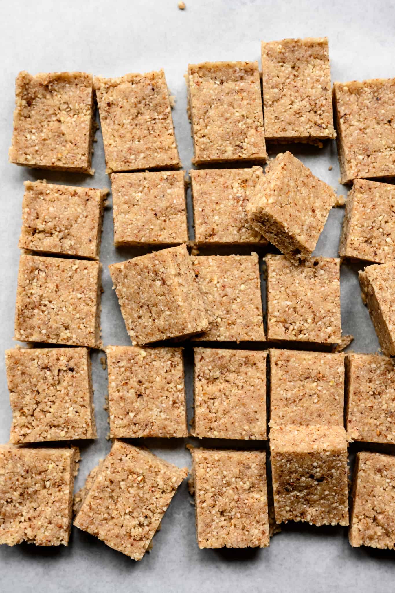 overhead of raw almond joy bar filling on a white background