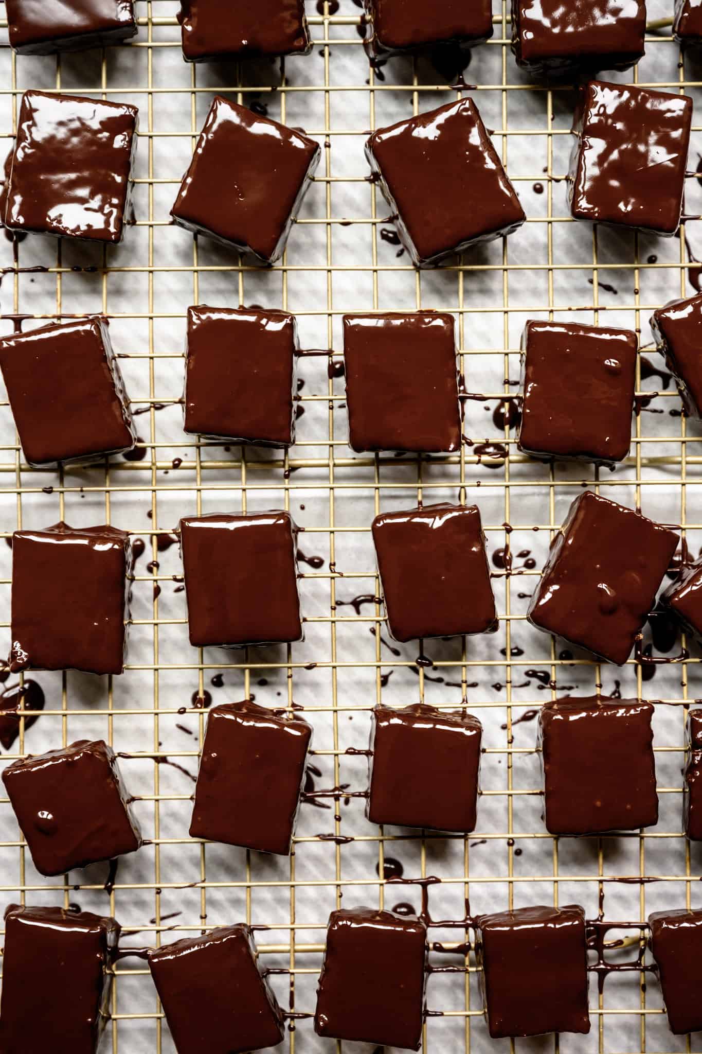 overhead of chocolate covered almond joy bars on a wire rack