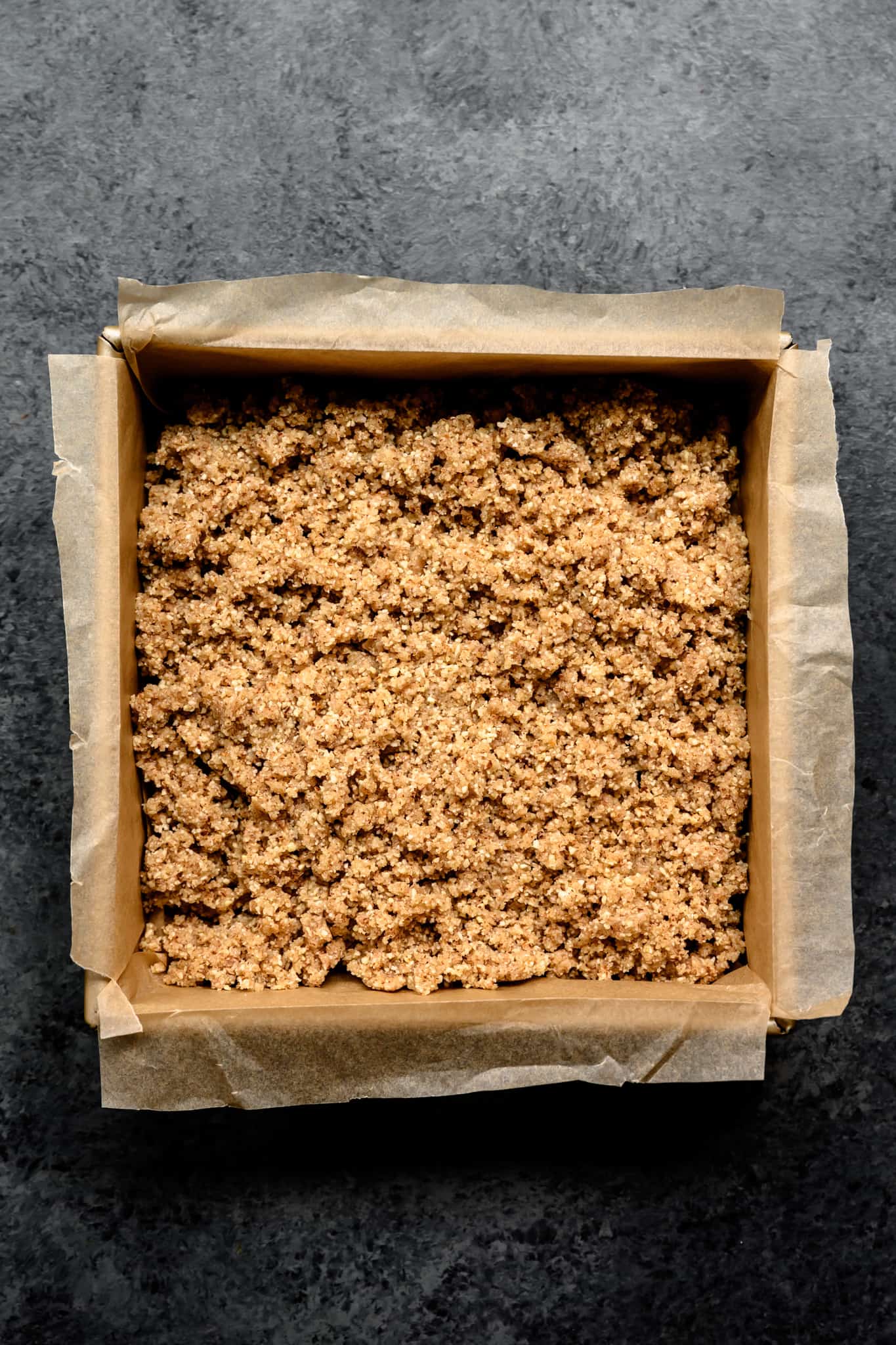 overhead of almond joy filling in a baking sheet 