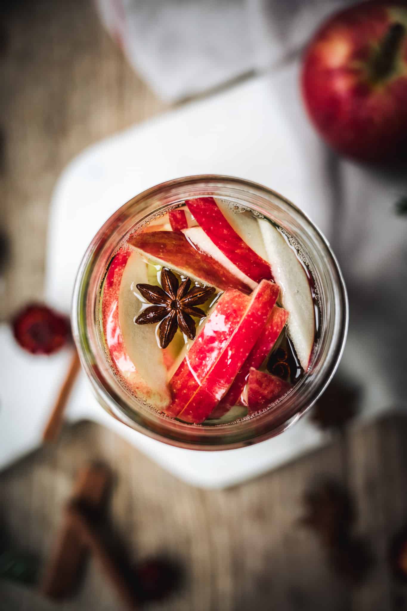 close up overhead of homemade apple and pear infused vodka