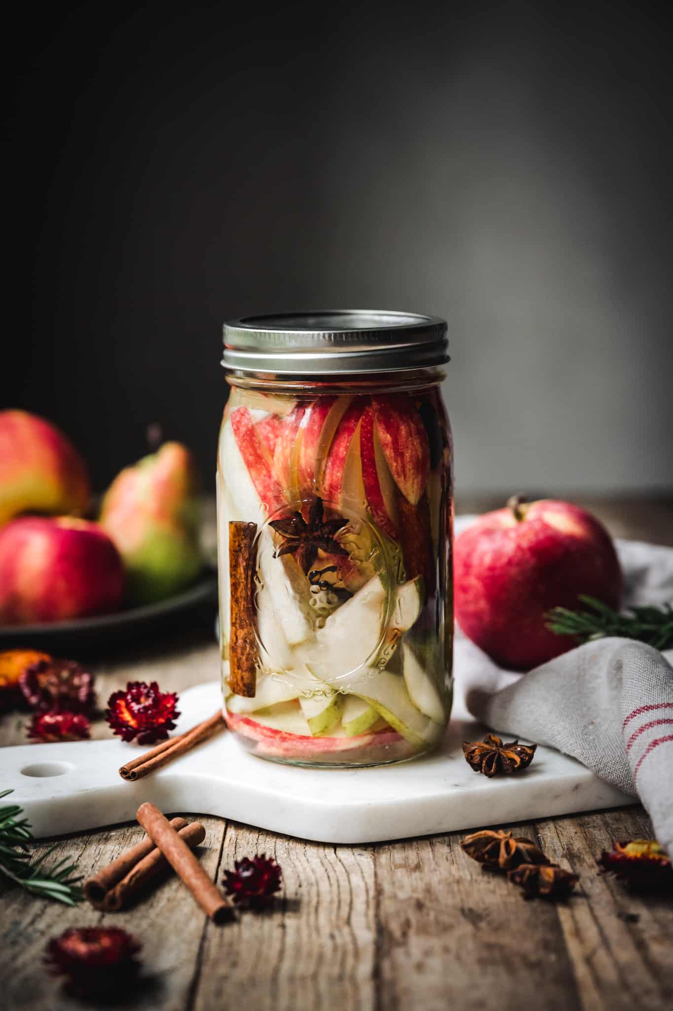 Side view of homemade apple and pear infused vodka