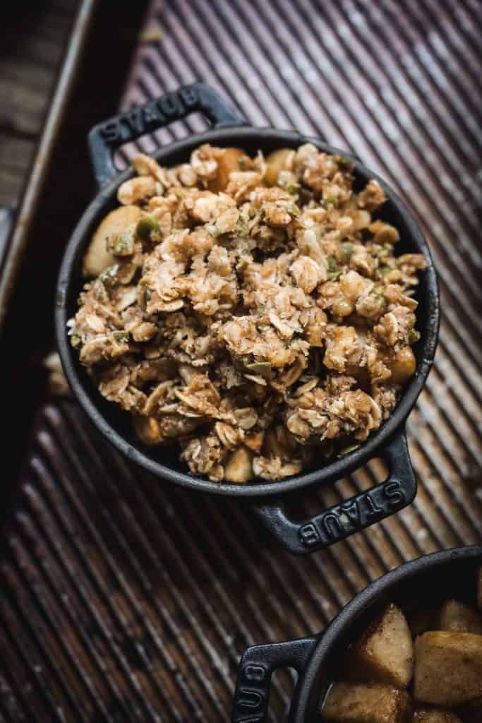 overhead view of unbaked apple crisp in a small ramekin