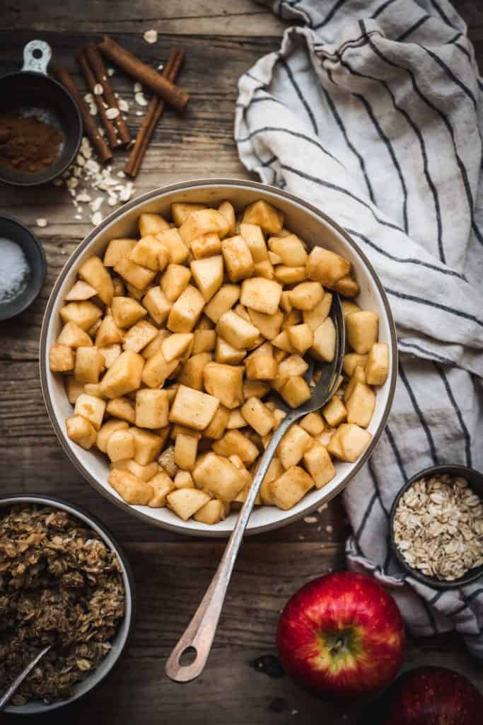 overhead of chopped apples before baking in an apple crisp