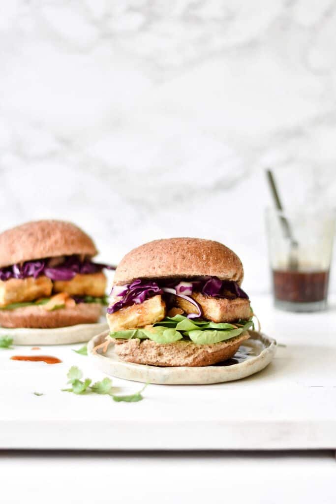 side view of two crispy tofu burgers