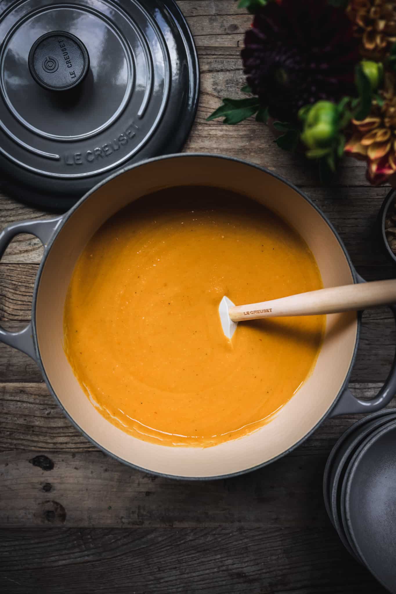 overhead view of vegan coconut curry butternut squash soup in a large pot