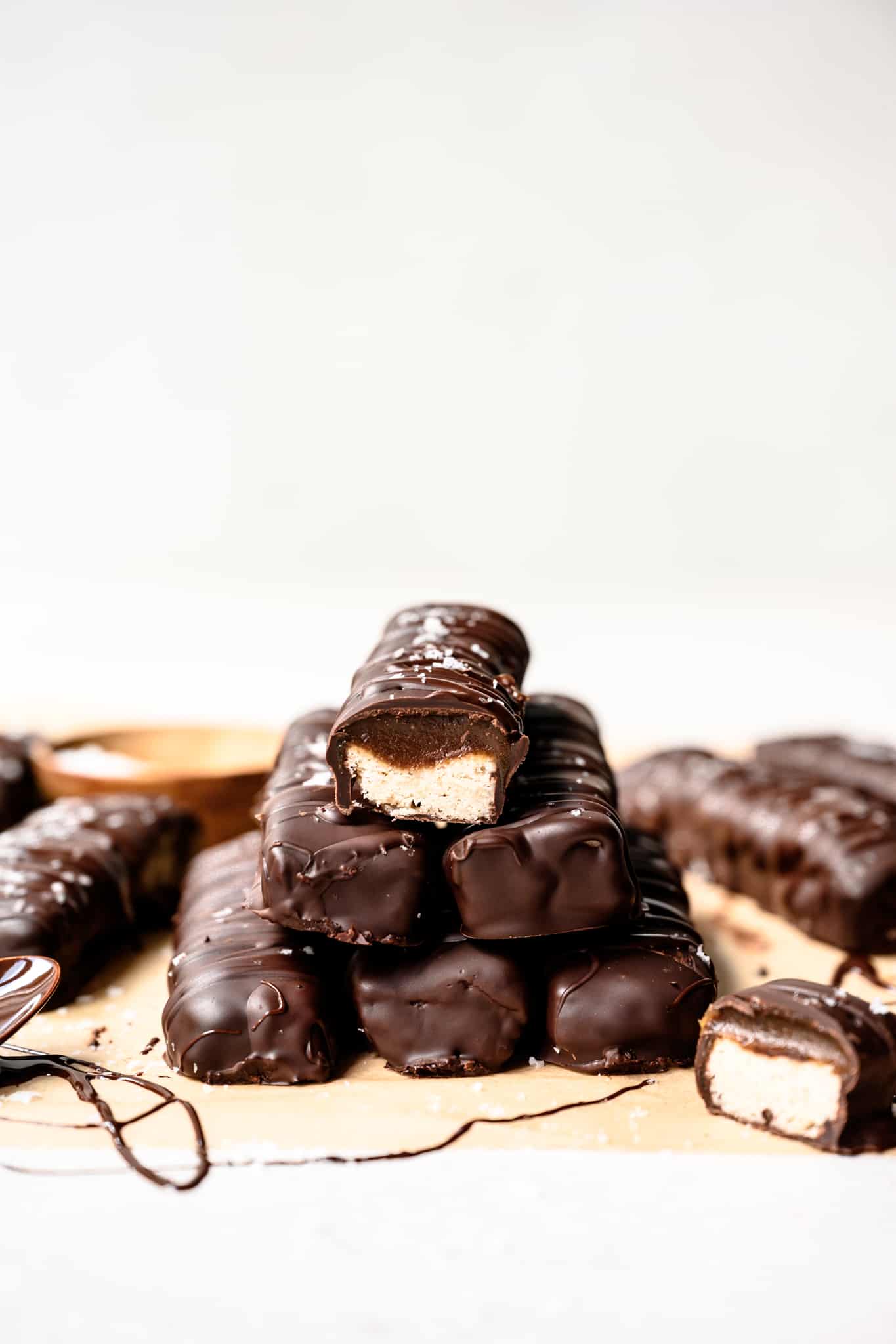 Side view of a large stack of homemade gluten free and vegan twix bars