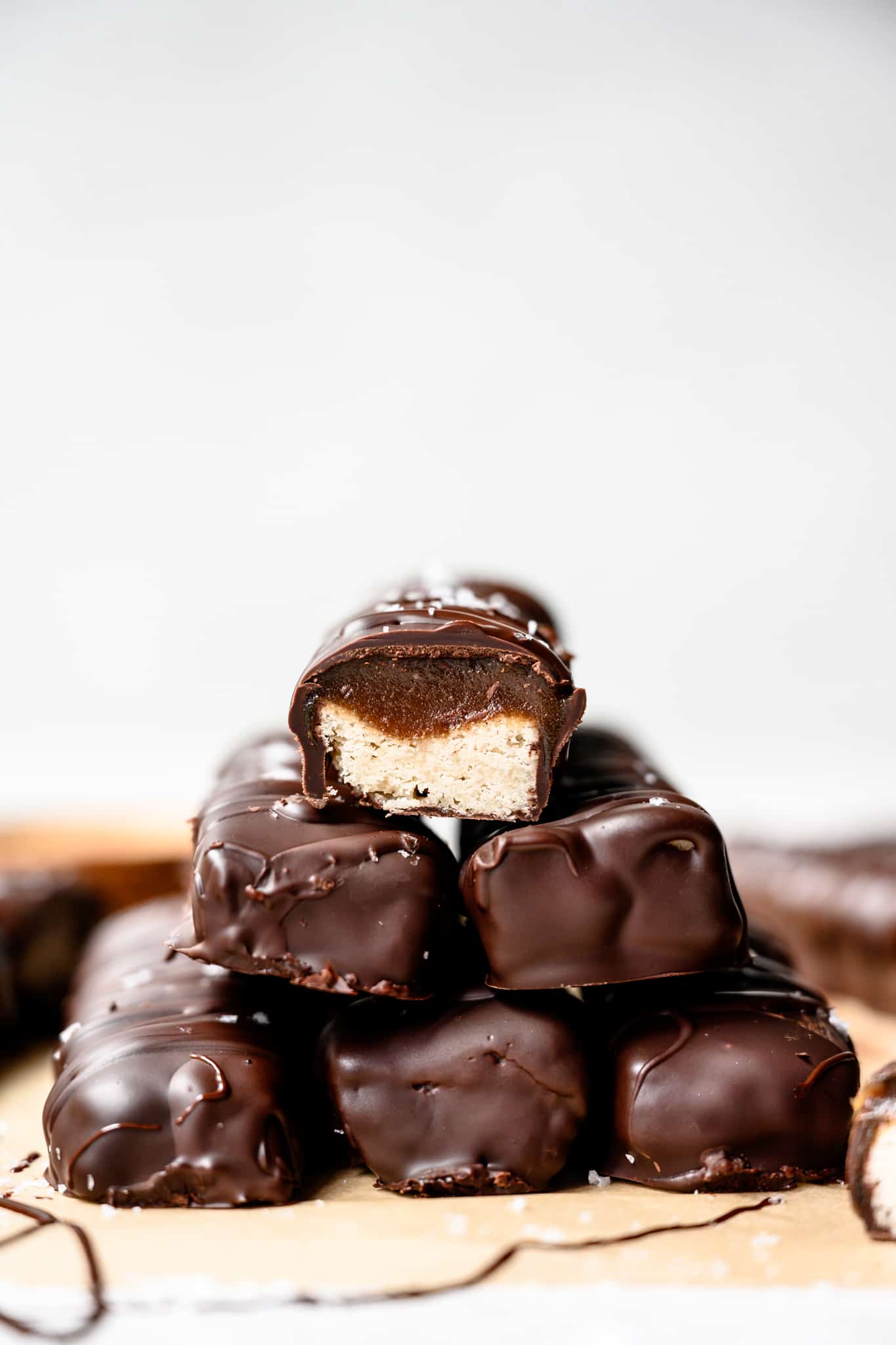 Side view of a large stack of homemade gluten free and vegan twix bars