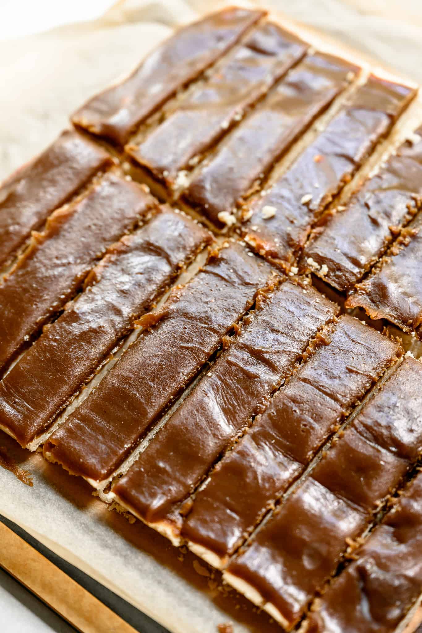 side view of vegan and gluten free twix bars with vegan caramel layer