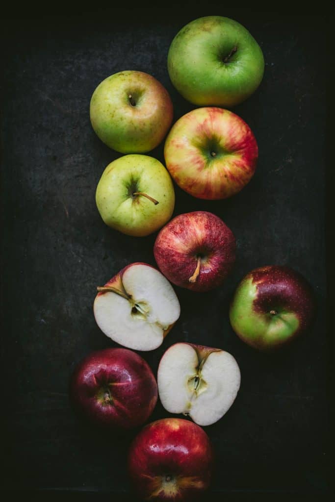 beautiful photography of multi-colored apples on a dark background