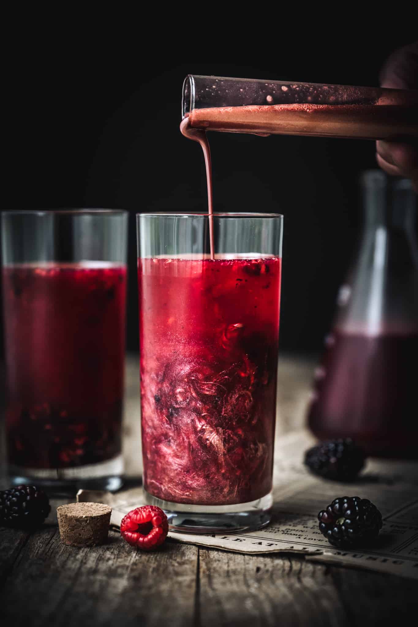 pouring shimmer dust into halloween cocktail