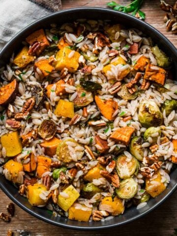 Overhead view of orzo salad in a bowl.