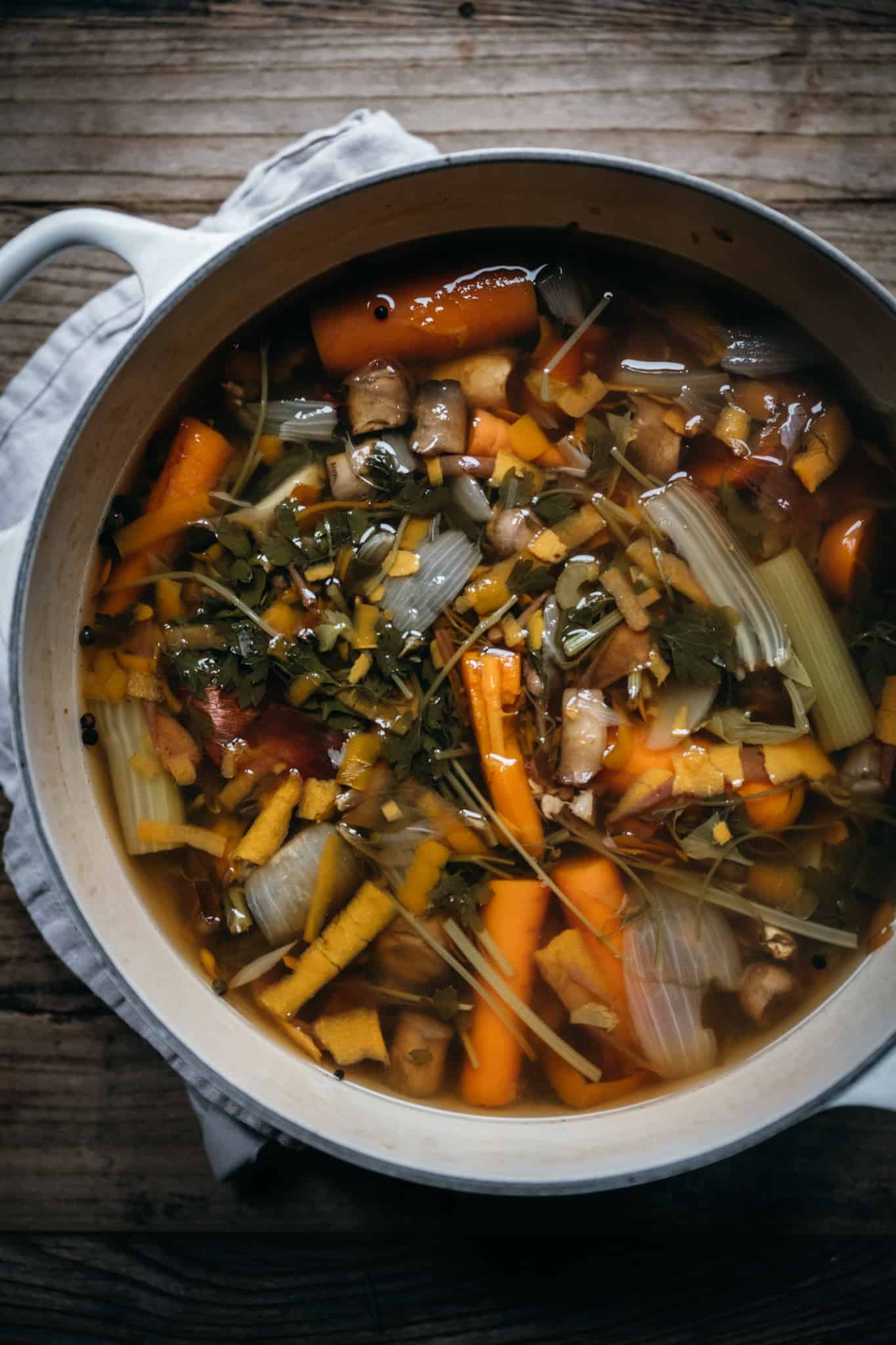 overhead view of cooked homemade vegetable broth in a large pot