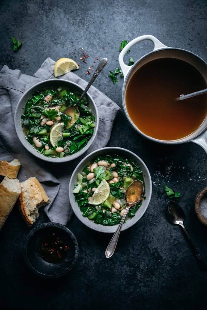 overhead view of green soup with homemade vegetable broth