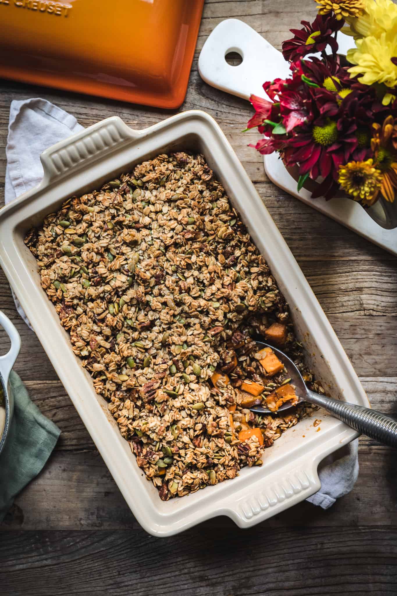 overhead view of healthy vegan sweet potato casserole with granola topping