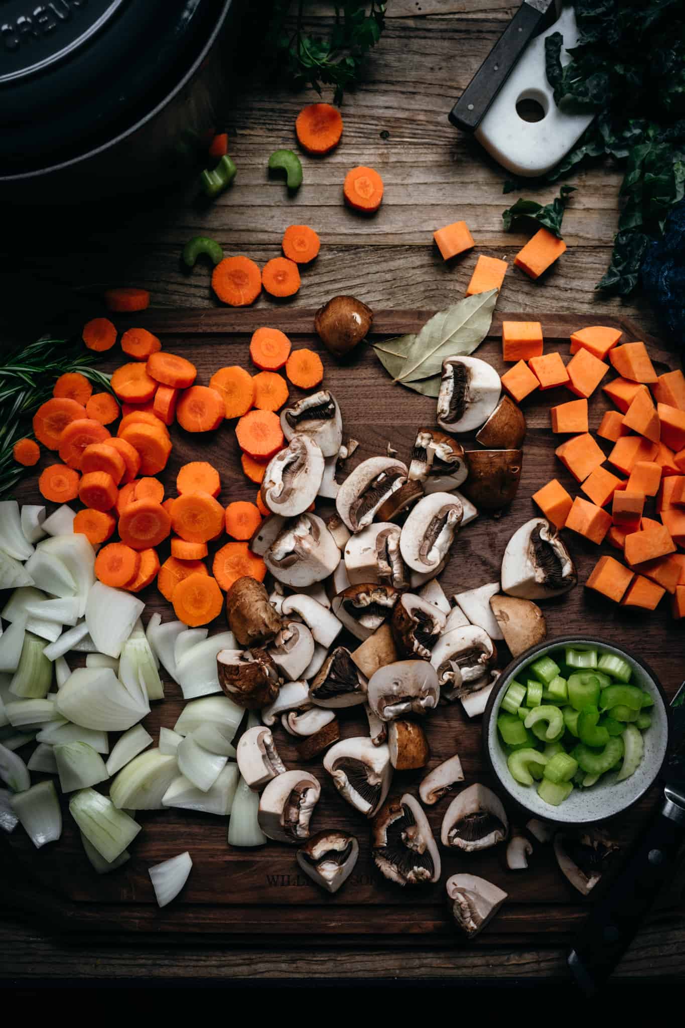 fall vegetables on a cutting board on wood table