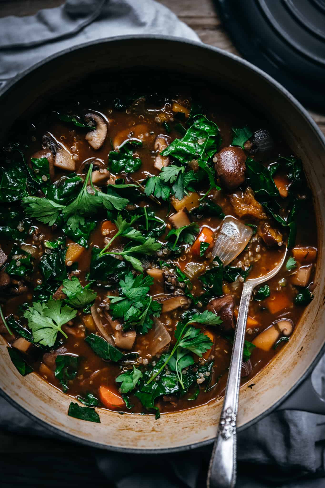 overhead of vegetable quinoa mushroom stew in a large dutch oven