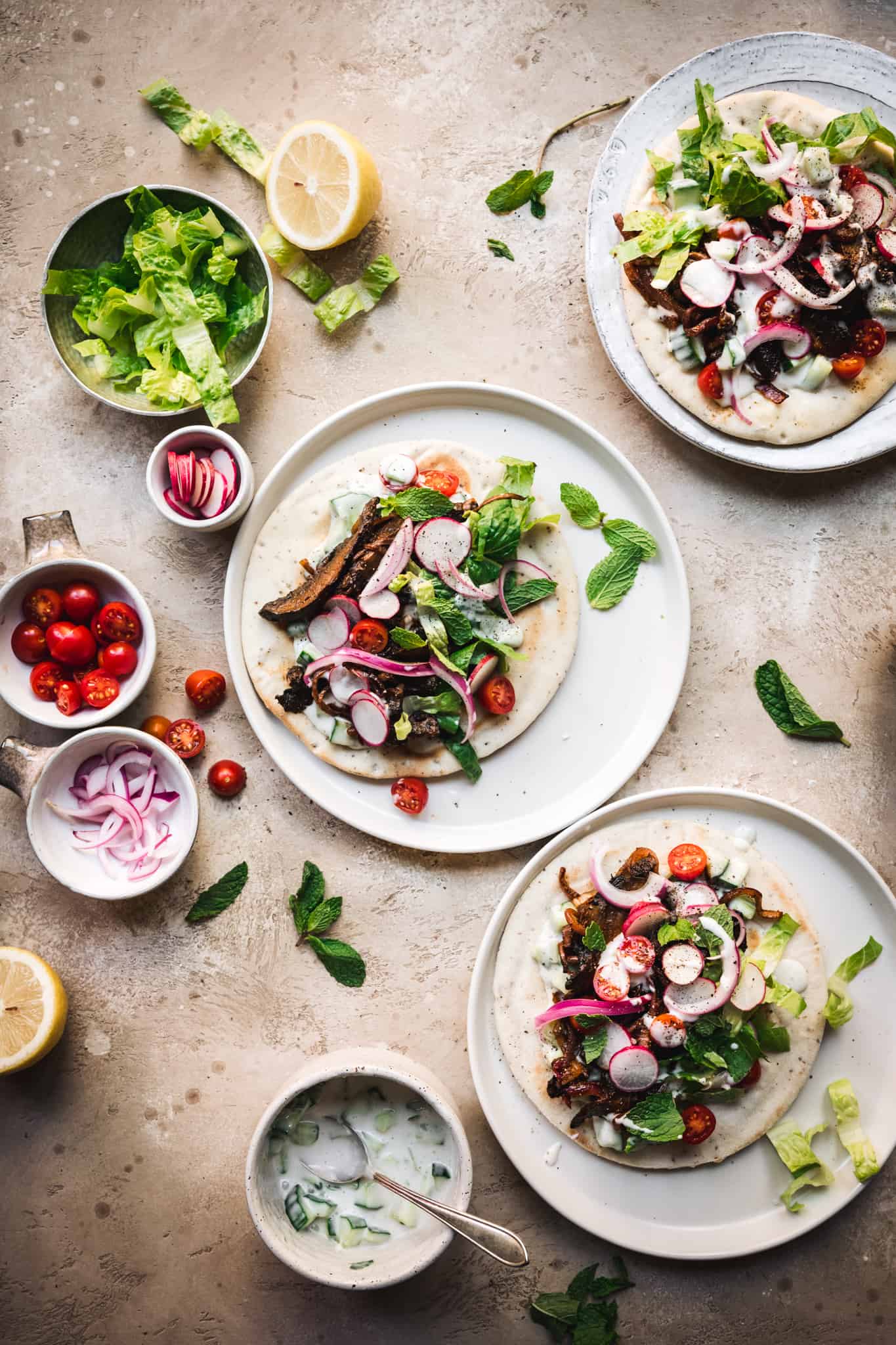 overhead view of vegetarian mushroom shawarma with vegan tzatziki on pita