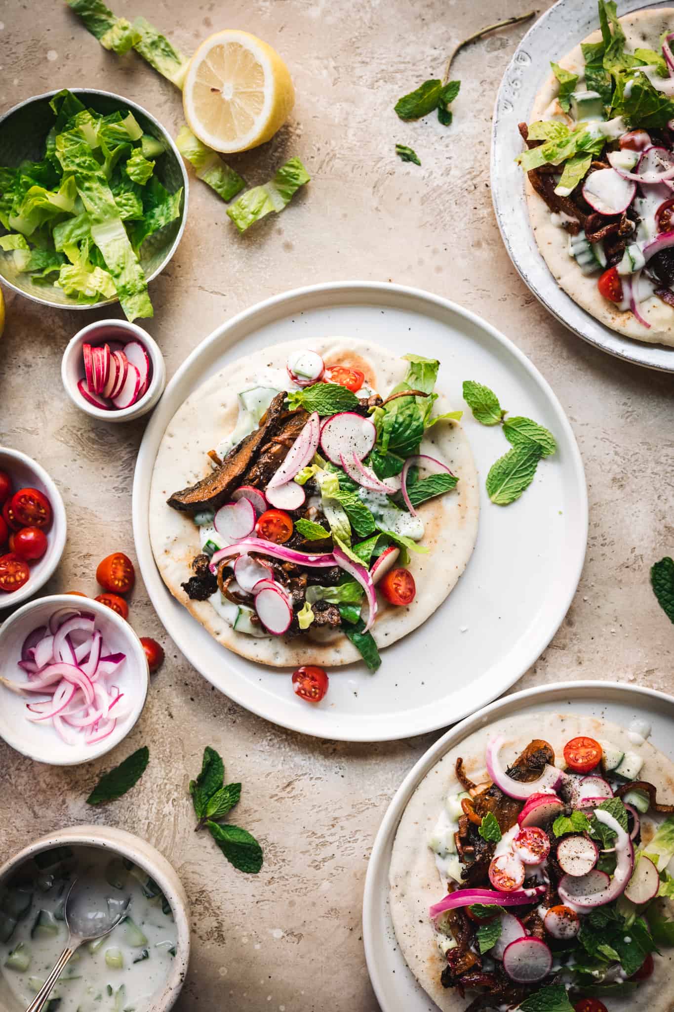 overhead view of vegan mushroom shawarma on pita with vegetarian toppings