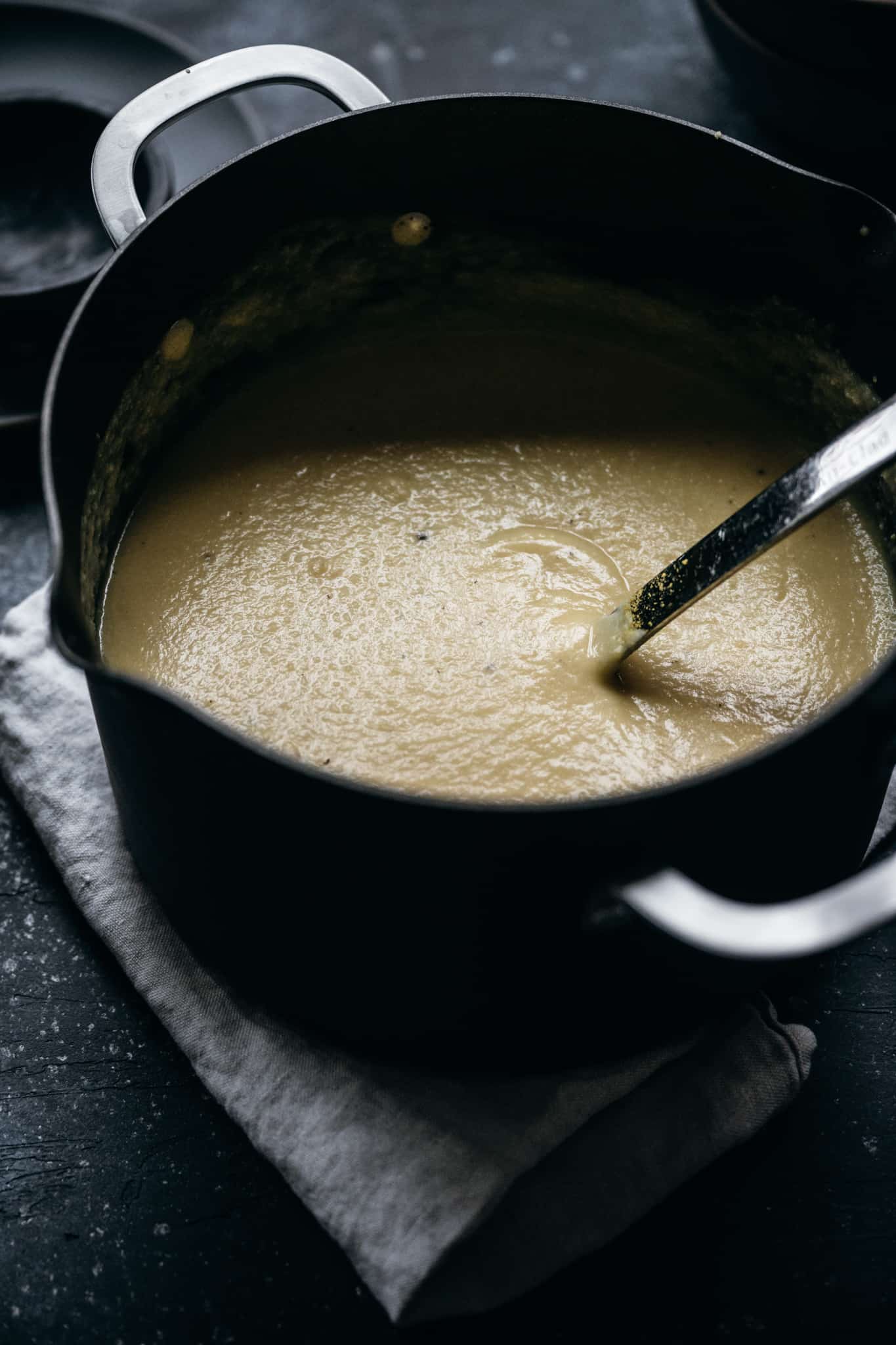 Side view of vegan cauliflower soup in pot