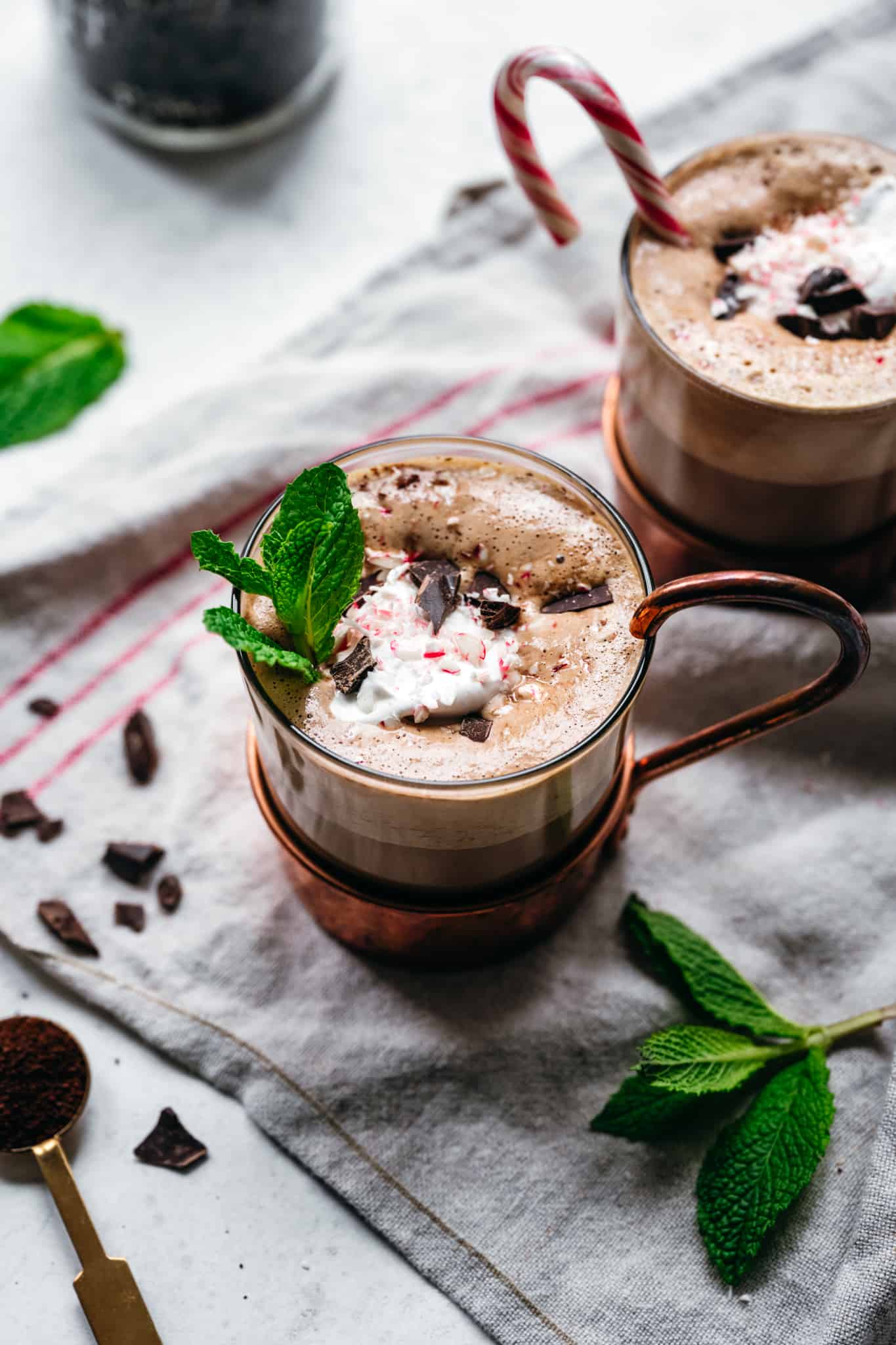 side view of vegan peppermint mocha with candy cane
