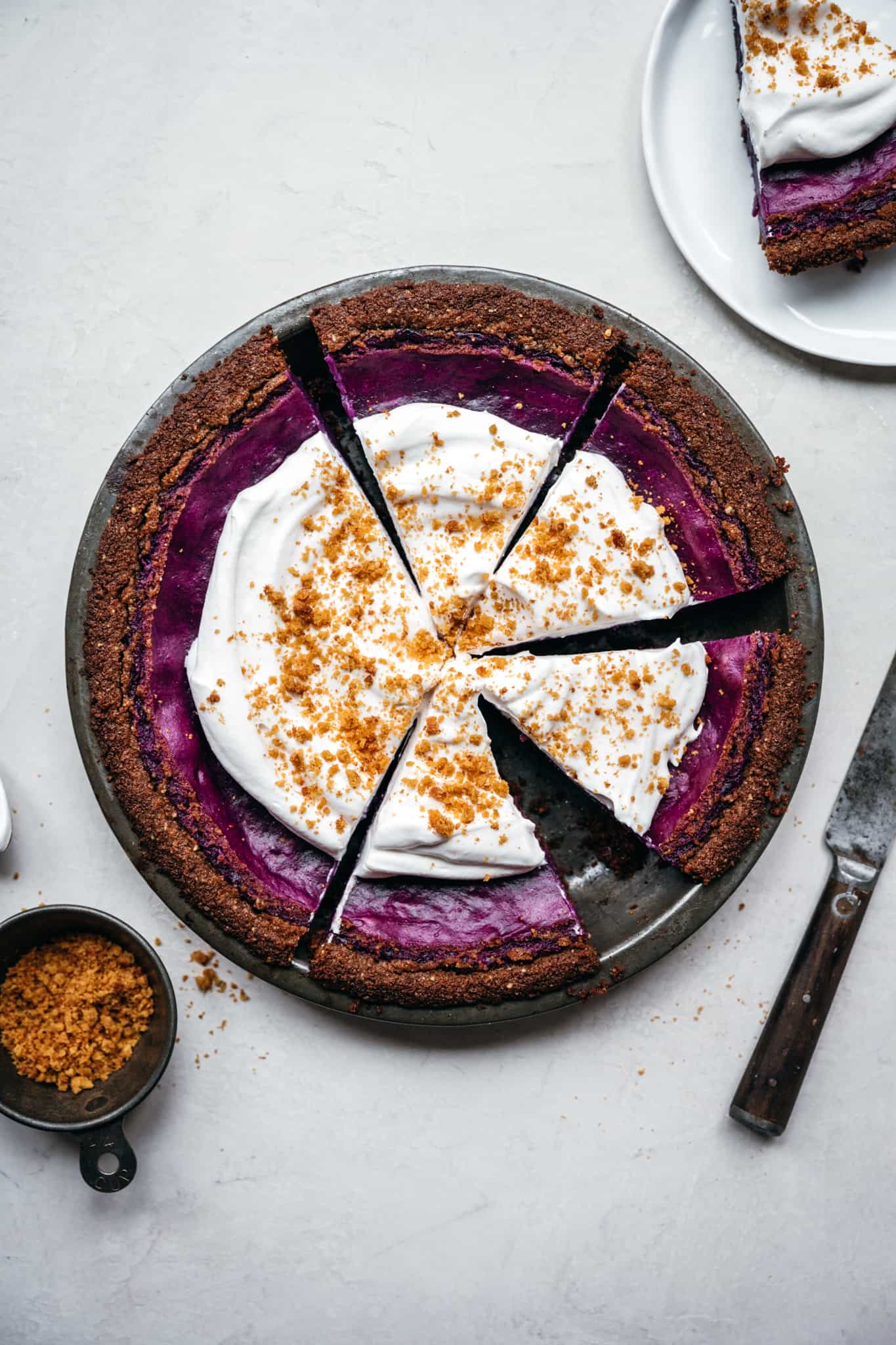overhead view of vegan purple sweet potato pie sliced in a pie pan