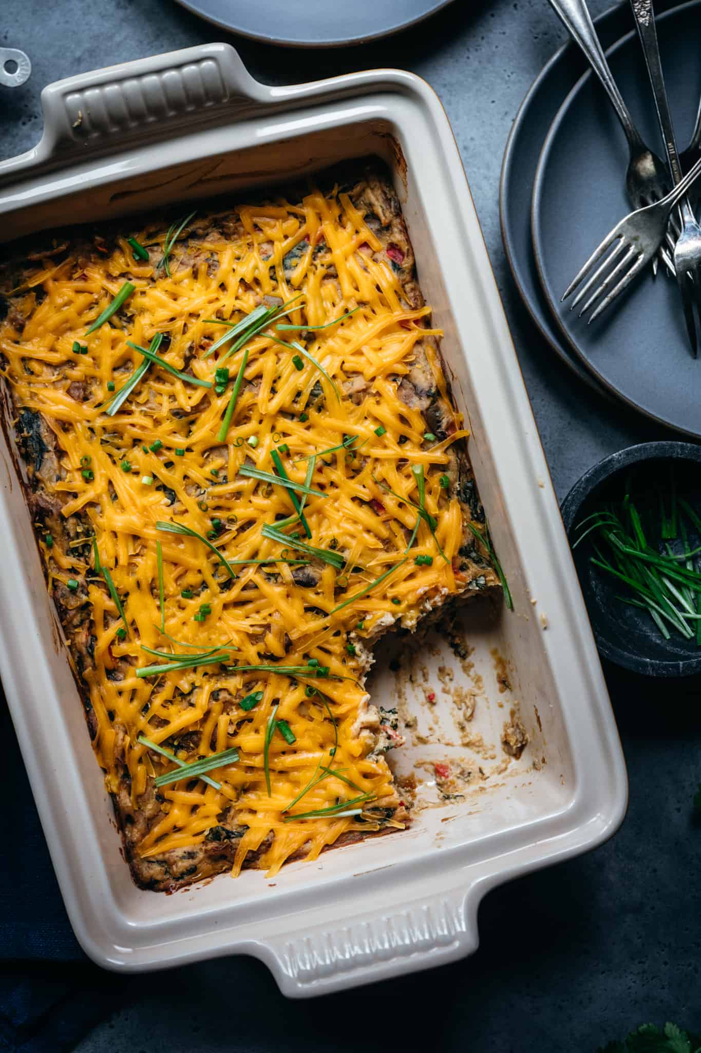 close up overhead view of vegan breakfast casserole with cheddar cheese