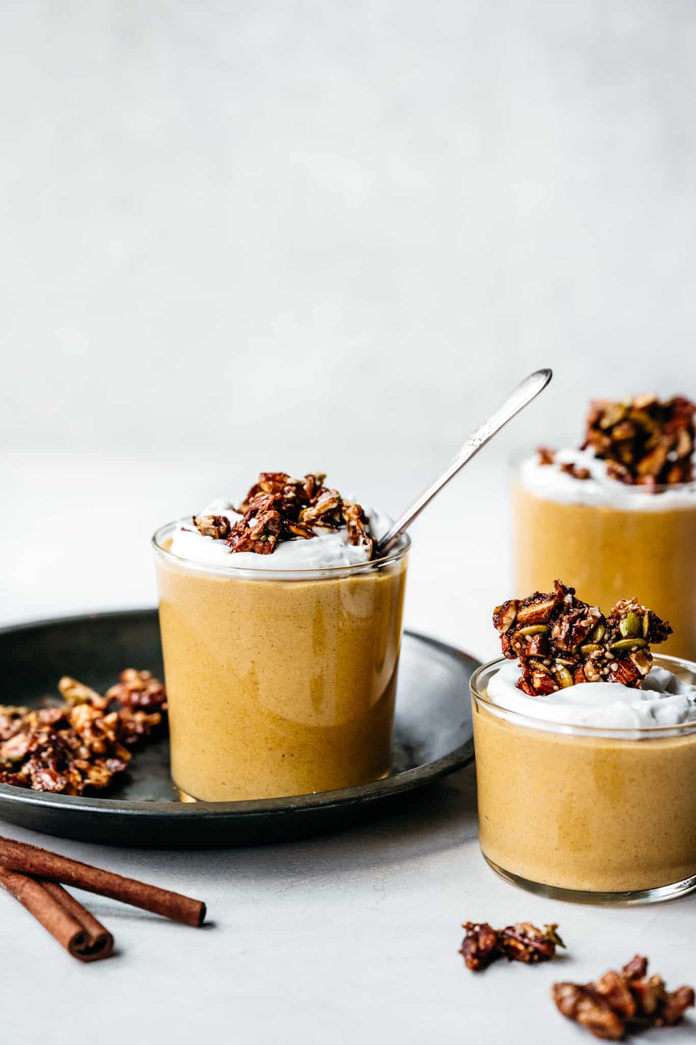 side view of creamy vegan pumpkin mousse in glass jars