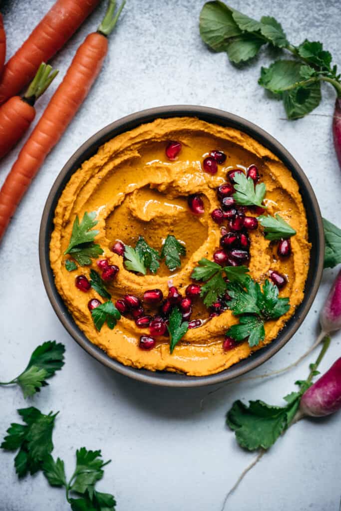overhead of vegan roasted carrot dip in a bowl