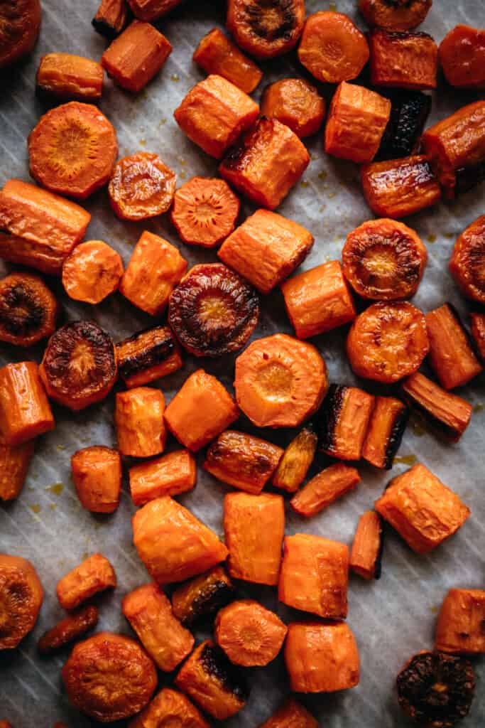 overhead of roasted carrots on a baking sheet