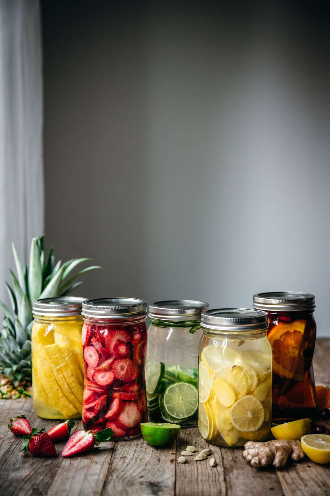 side view of colorful fruit infused liquors