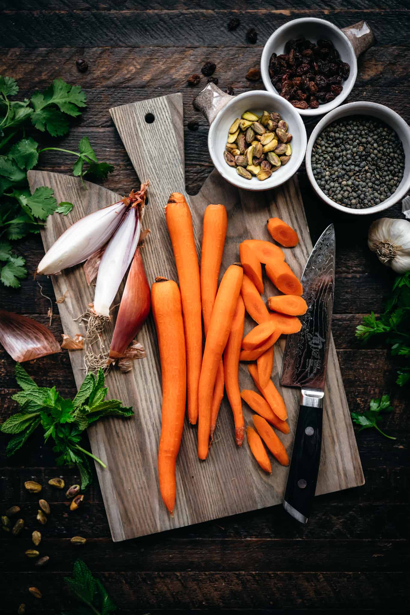 overhead view of ingredients for vegan lentil and carrot salad on cutting board