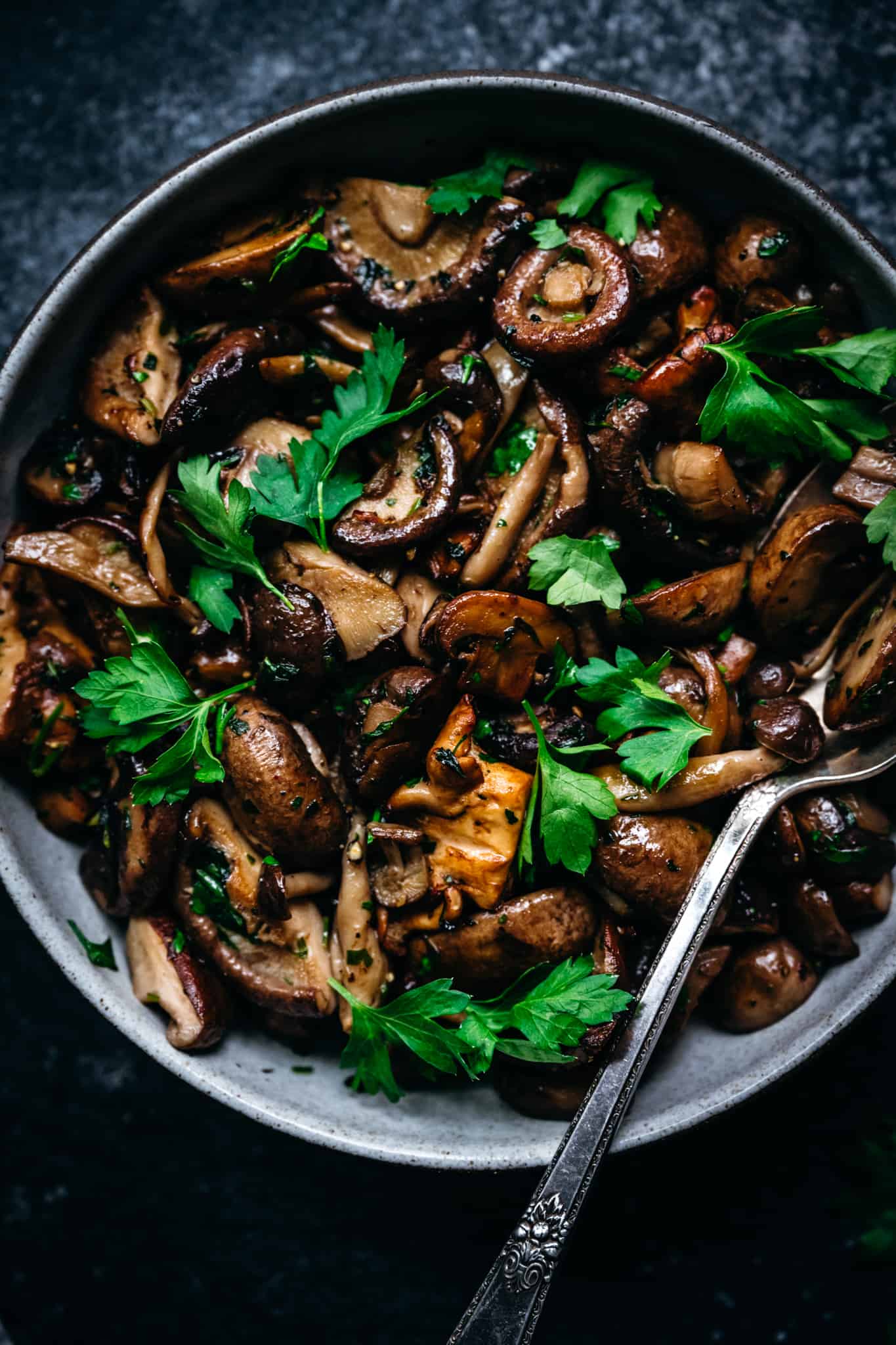 overhead of pan seared wild mushrooms in a bowl