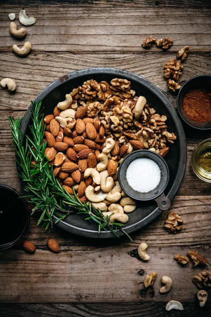 overhead of raw nuts before they're cooked for vegan spiced nuts