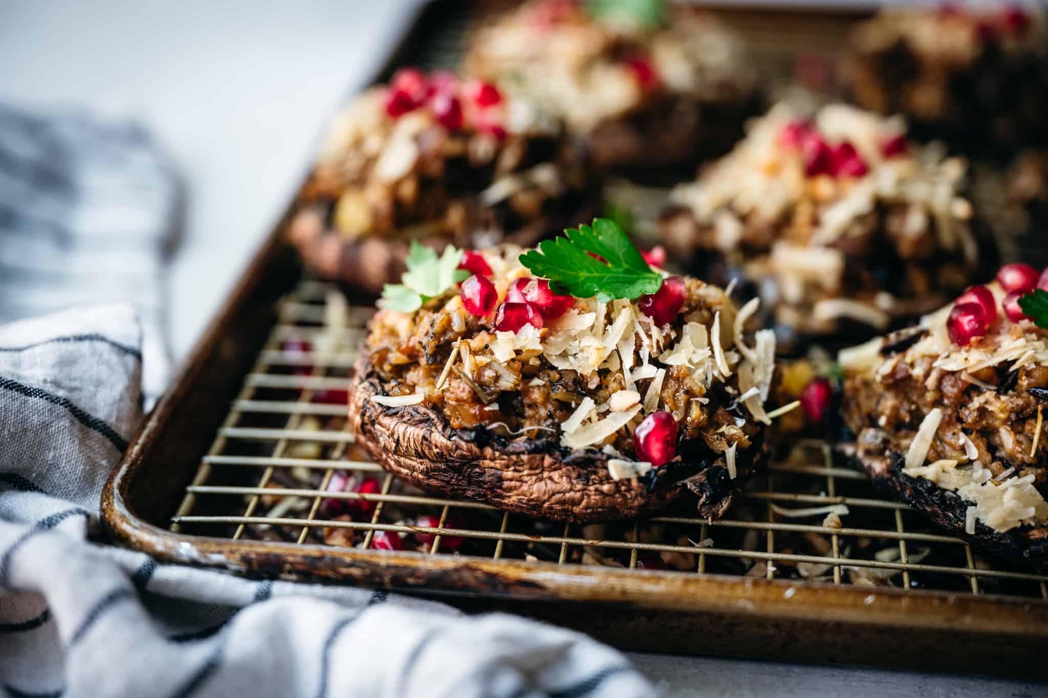 45 degree overhead of vegan stuffed portobello mushrooms on a wire baking rack