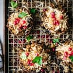 overhead of vegan stuffed portobello mushrooms on a wire rack over a baking sheet