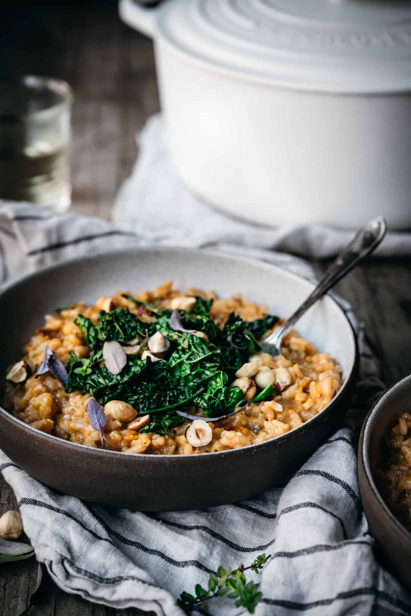 side view of sweet potato risotto with fork in bowl